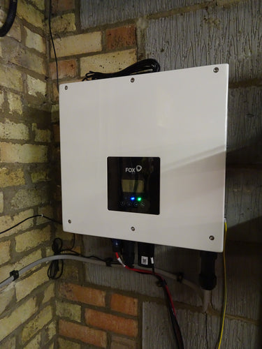 Close-up of Fox ESS 5kw AC charger mounted on wall.